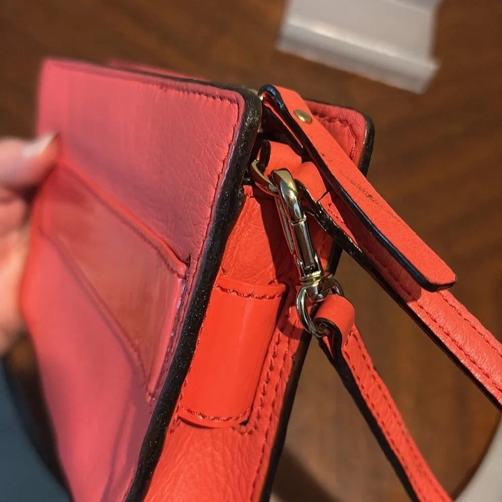 Kate Spade wristlet  pebble leather/patent bow on front  orangeish red gold NWOT